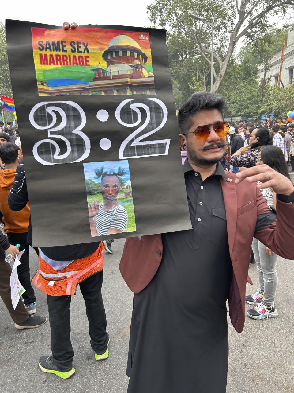 A participant of the Delhi Queer Pride Parade carries a banner during the march in New Delhi, India, Sunday, Nov. 26, 2023. This annual event comes as India's top court refused to legalize same-sex marriages in an October ruling that disappointed campaigners for LGBTQ+ rights in the world's most populous country. (AP Photo/Shonal Ganguly)