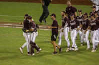 Mississippi State pitcher Landon Sims (23) receives a hug from catcher Logan Tanner (19) after their win over Virginia during a baseball game in the College World Series Tuesday, June 22, 2021, at TD Ameritrade Park in Omaha, Neb. (AP Photo/John Peterson)