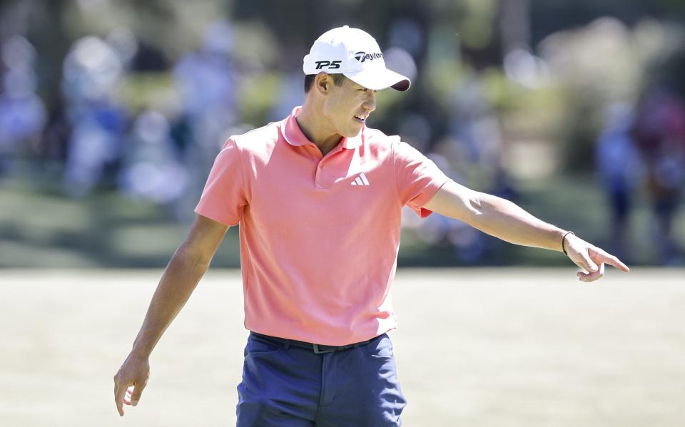 Collin Morikawa points on the third green