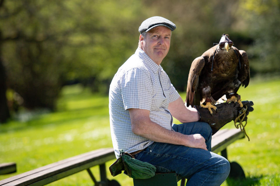 Head falconer Chris O'Donnell with a White-tailed Sea Eagle at Warwick Castle, Warwick, home to the UK's biggest birds of prey show. The castle's birds are unable to give their regular displays as the UK continues in lockdown to prevent the spread of coronavirus.