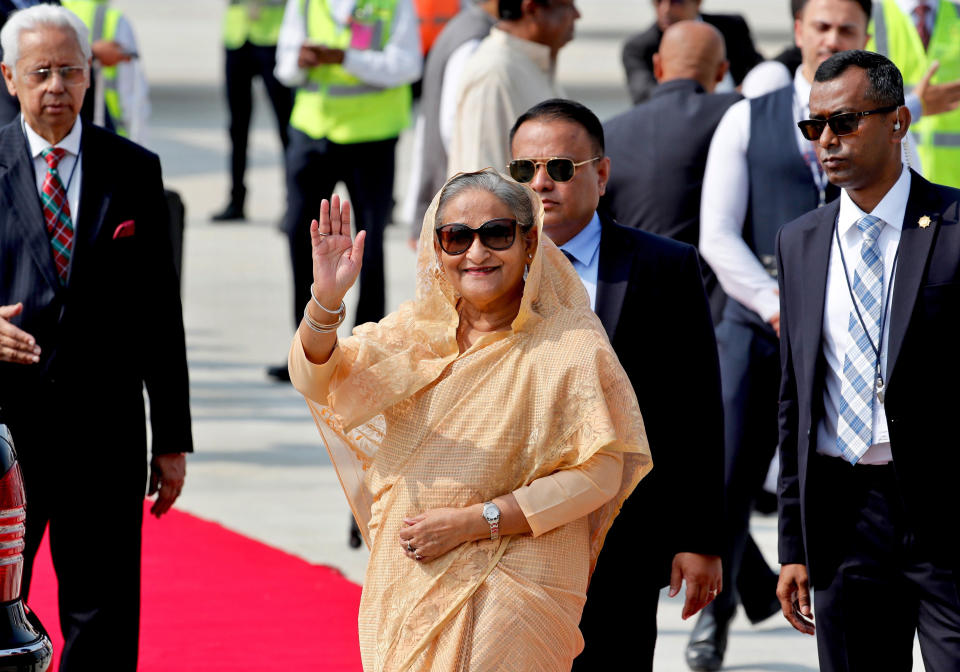 Bangladesh Prime Minister Sheikh Hasina waves as she arrives at the airport in New Delhi, India, Thursday, Oct.3, 2019. Hasina is on a three-day visit to India. (AP Photo/Manish Swarup)