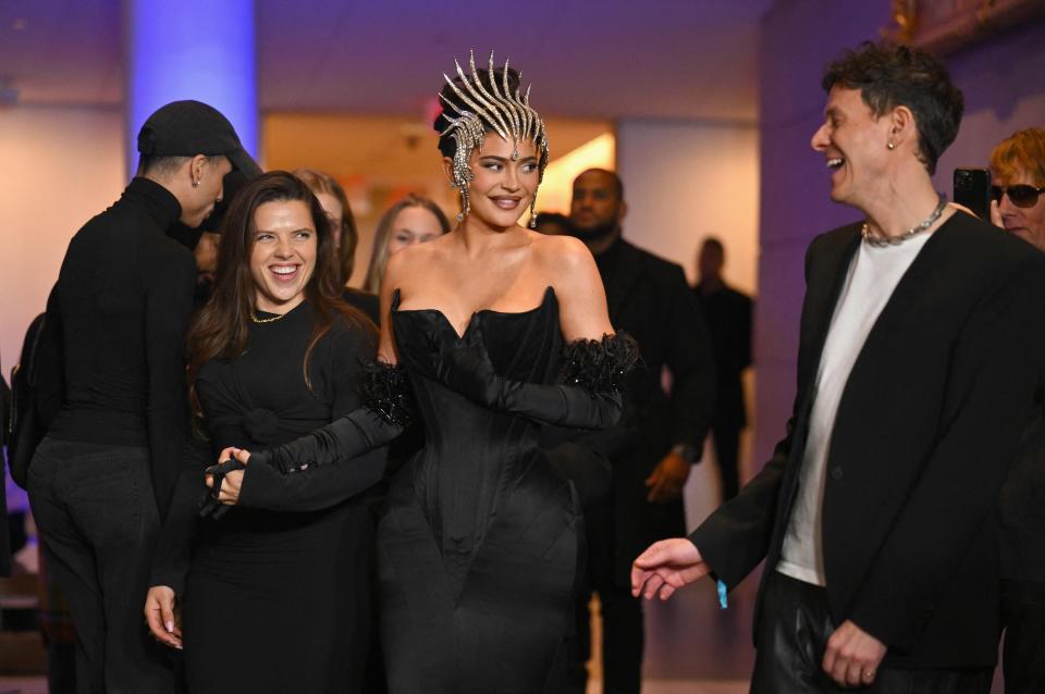 In an ushering of the new guard, Mugler's newest creative director Casey Cadwallader guided the youngest adult member of the Kardashian-Jenner clan as the pair gazed upon the complexities of Mugler's futuristic superwoman designs.