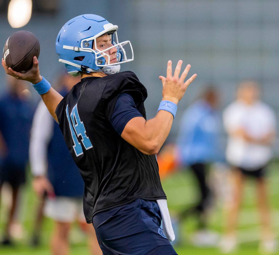 North Carolina graduate transfer quarterback Max Johnson (14) looks for an open receiver during the Tar Heels’ first practice of the season on Monday, July 29, 2024 in Chapel Hill, N.C.