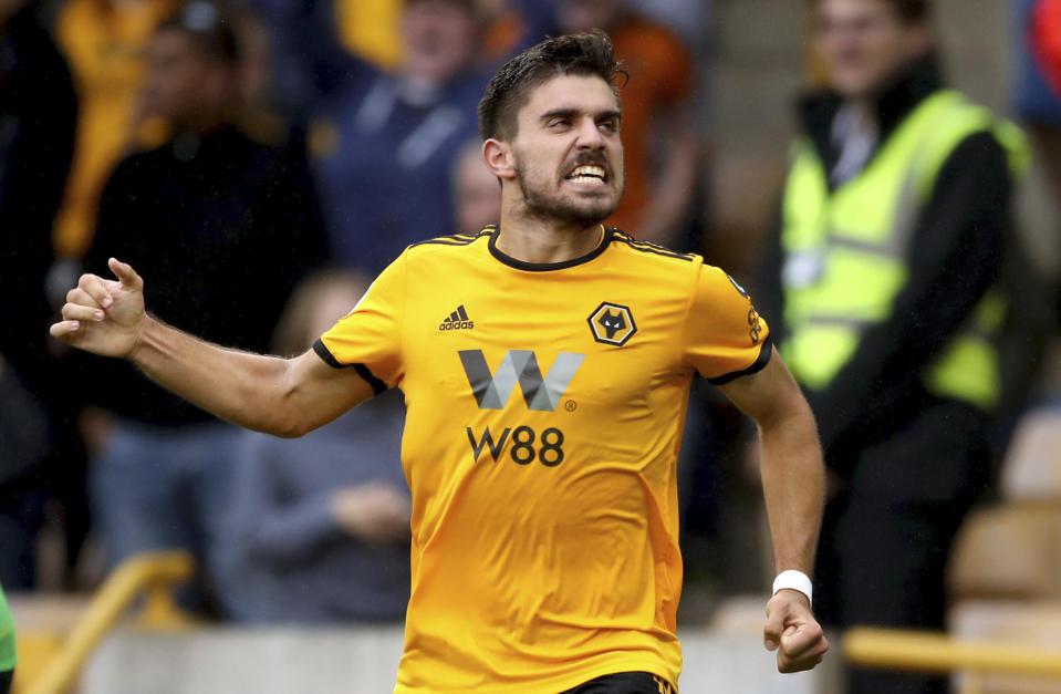 Wolverhampton Wanderers' Ruben Neves celebrates scoring his side's first goal of the game against Everton, during their English Premier League soccer match at Molineux in Wolverhampton, England, Saturday Aug. 11, 2018. (Nick Potts/PA via AP)