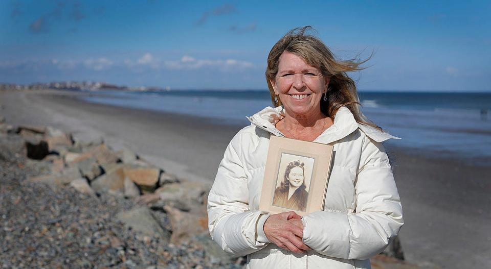 Maria Writesel holds a photo of her mom.  Writesel, of Hull, remembers her 94-year-old mother, Marie McElroy Writesel Jenkins, who spent many years in Hull both for summers as a child and then year round as an adult on Thursday, Feb. 10, 2022.