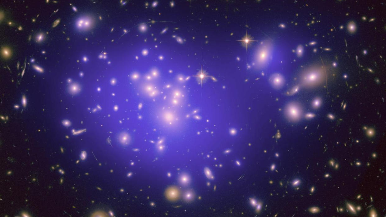  A view of galaxy cluster abell 1689 with purple galaxies and bright stars 