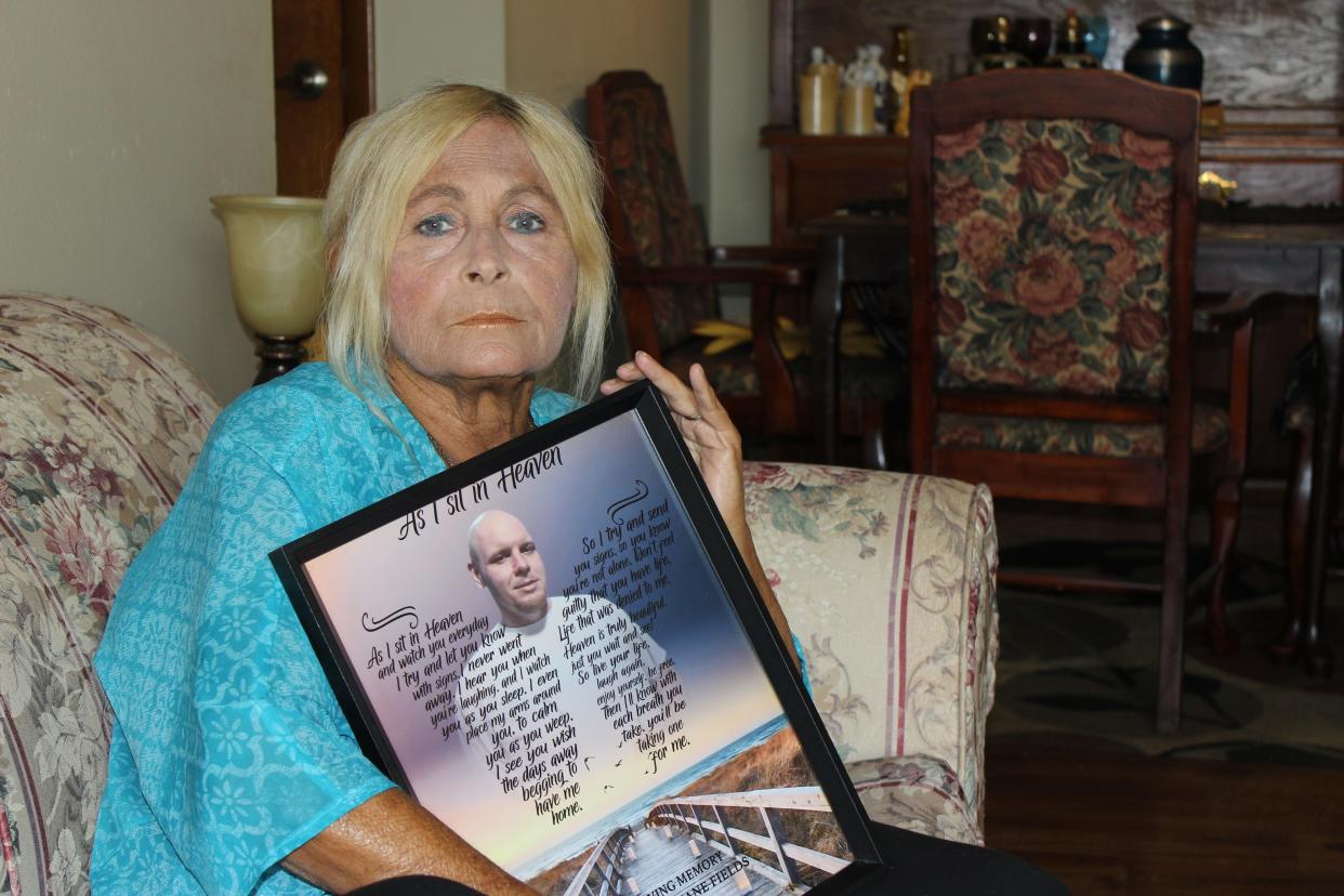 Penny Meade holds a photo of her son Jeremiah Shane Fields who died at a Ballad Health hospital in 2019. The Centers for Medicaid & Medicare Services investigated the death and found Fields’ care was not up to standard.