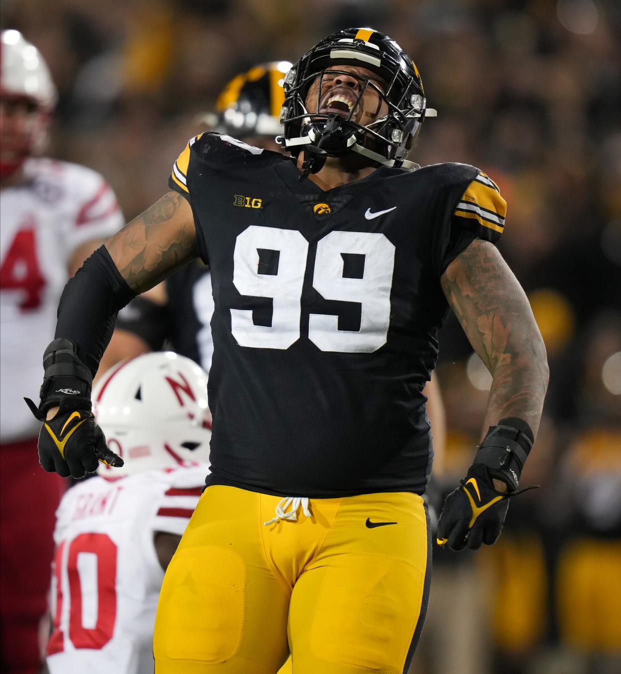 Iowa defensive lineman Noah Shannon (99) reacts after tackling Nebraska running back Anthony Grant for a loss of yards in the fourth quarter during a NCAA football game on Friday, Nov. 25, 2022, at Kinnick Stadium in Iowa City.