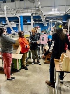 Eighth-grade students tour the Advanced Manufacturing/Millwork program at the R.W. Creteau Regional Technology Center in Rochester.