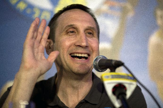 Maccabi Tel Aviv's head coach David Blatt speaks in a news conference in Tel Aviv, Israel,Thursday, June 12, 2014. David Blatt has stepped down as coach of European club champion Maccabi Tel Aviv to pursue a job in the NBA. Blatt told a news conference on Thursday he wanted to fulfil his "dream" of coaching in the NBA. He says he is weighing offers from unnamed teams. The Cleveland Cavaliers, Minnesota Timberwolves and Golden State Warriors are all believed to be interested. Blatt, who grew up near Boston and played college ball at Princeton, has had a successful career coaching overseas. Last month, he led Maccabi to an upset win over Real Madrid in the European basketball championship. At a championship celebration, Prime Minister Benjamin Netanyahu playfully told Blatt not to leave. (AP Photo/Ariel Schalit)