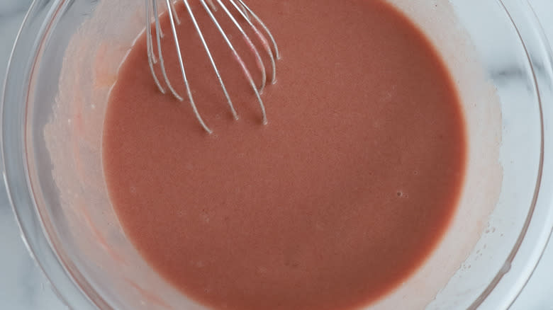 pink batter in clear bowl