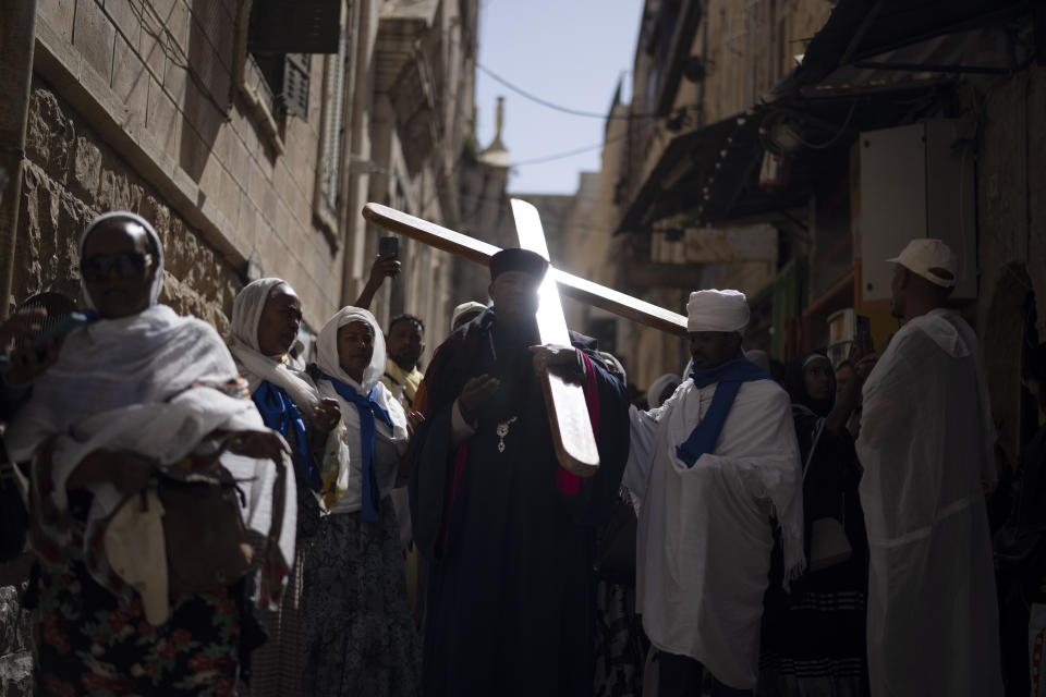 Ethiopian Orthodox Christian worshippers walk the Way of the Cross procession that commemorates Jesus Christ's crucifixion on Good Friday, in the Old City of Jerusalem, Friday, May 3, 2024. (AP Photo/Leo Correa)