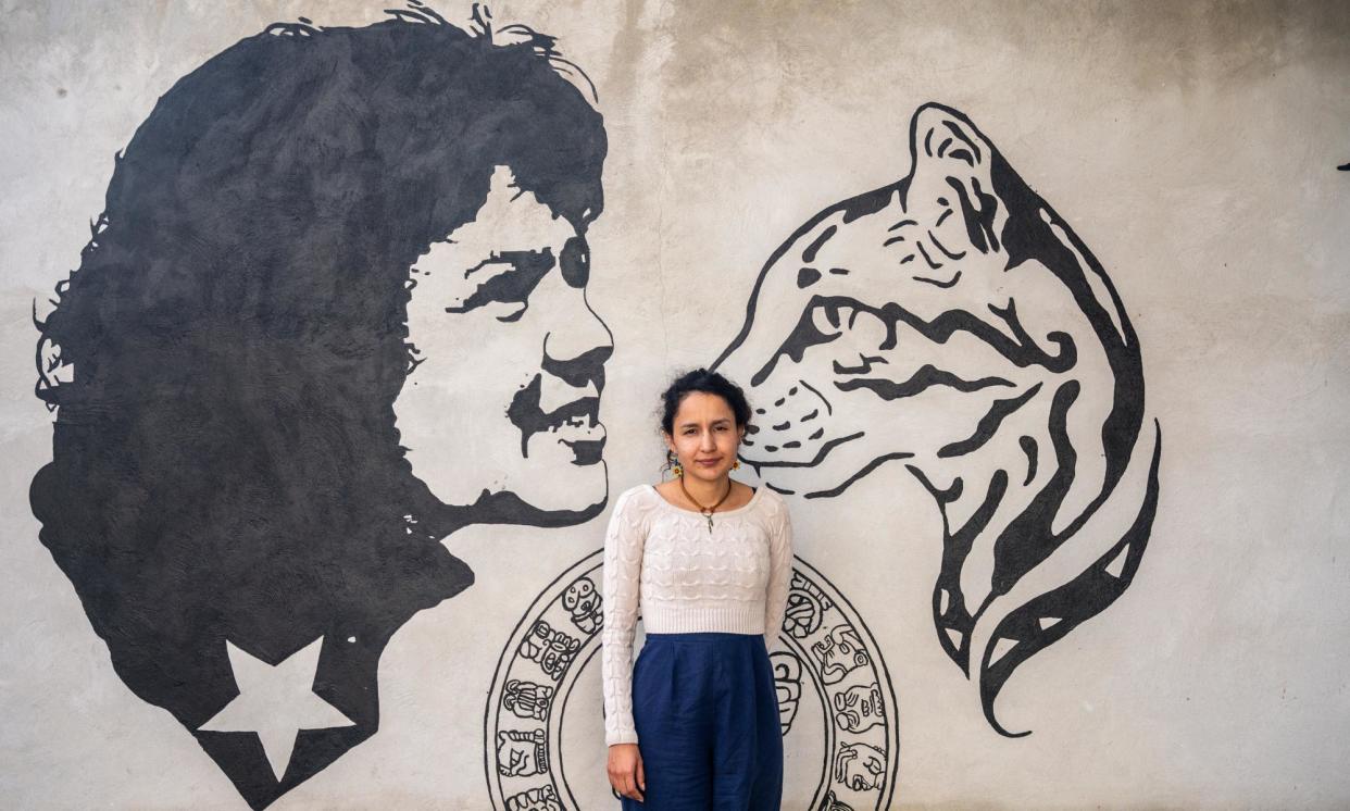 <span>Bertha Zúñiga Cáceres, stands in front of a mural dedicated to her mother, Berta Cáceres.</span><span>Photograph: Fritz Pinnow</span>