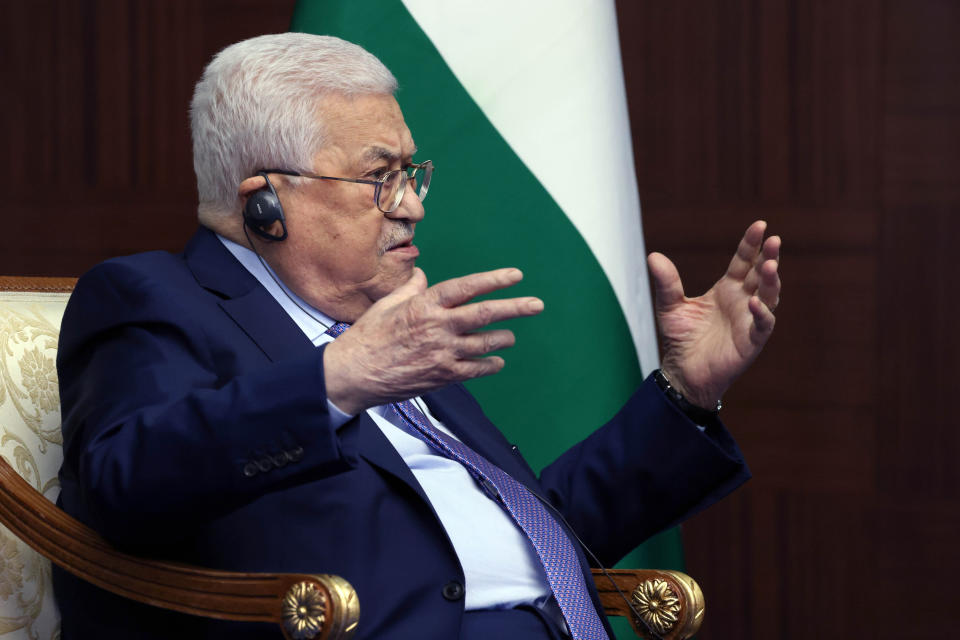 Palestinian President Mahmoud Abbas gestures while speaking to Russian President Vladimir Putin during their meeting on the sidelines of the Conference on Interaction and Confidence Building Measures in Asia (CICA) summit, in Astana, Kazakhstan, Thursday, Oct. 13, 2022. (Vyacheslav Prokofyev, Sputnik, Kremlin Pool Photo via AP)