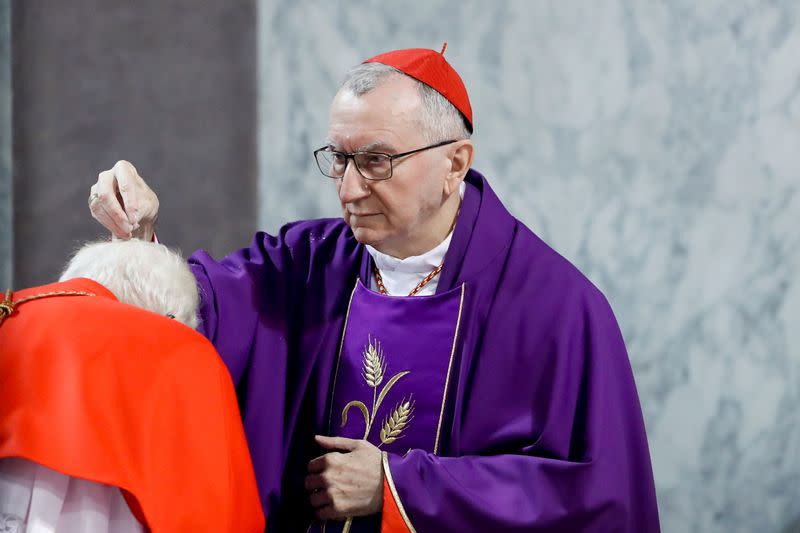 Vatican's Secretary of State puts ashes on a cardinal's head in Rome