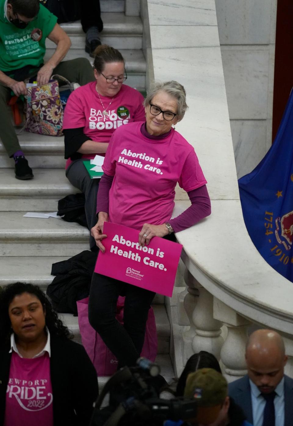 Supporters attend the Rhode Island Coalition for Reproductive Freedom press conference on Tuesday to mark the 50th anniversary of Roe v. Wade. 