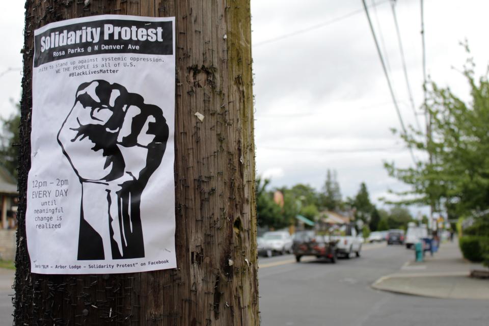 A sign advertising a daily protest in solidarity with Black Lives Matter is affixed to a telephone pole in a historically Black neighborhood in Portland, Ore., on July 1 2020. 