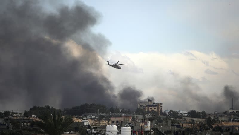 An Israeli helicopter flies over Khan Younis, Gaza Strip, on Feb. 15, 2024.