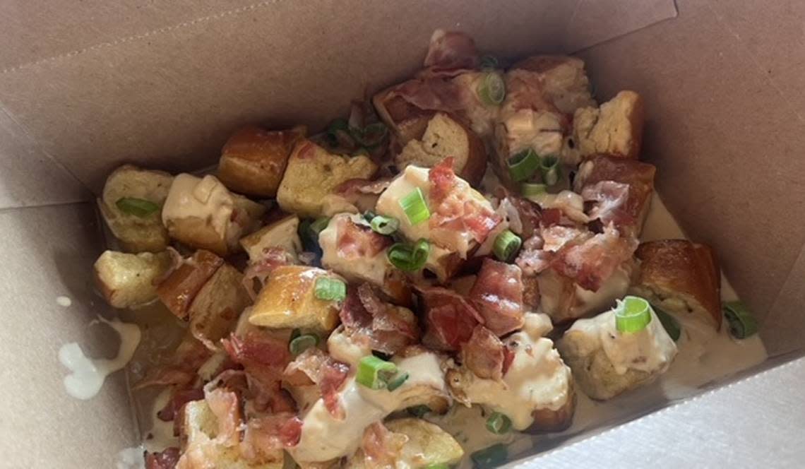 Little Woodrow’s loaded pretzel bites for $8, consisted of soft, buttery pretzels topped with queso cheese, bacon, and chopped green onions.