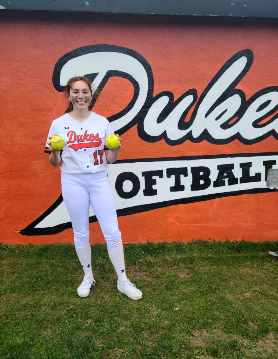 Marlboro softball player Ava DelSalto poses with her souvenir balls after hitting two home runs in an April 18 game.