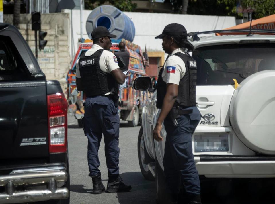 Haiti National Police check identifications at a check point in Port-au-Prince, Haiti.