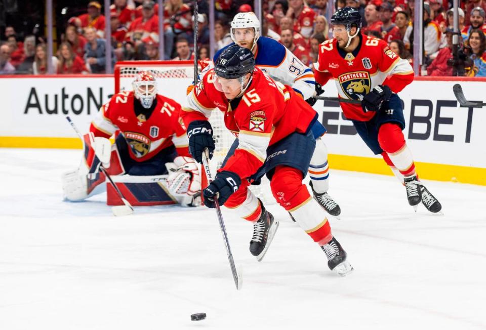 Florida Panthers center Anton Lundell (15) skates with the puck away from Edmonton Oilers center Connor McDavid (97) in the second period of Game 2 of the NHL Stanley Cup Finals at the Amerant Bank Arena on Monday, June 10, 2024, in Sunrise, Fla.