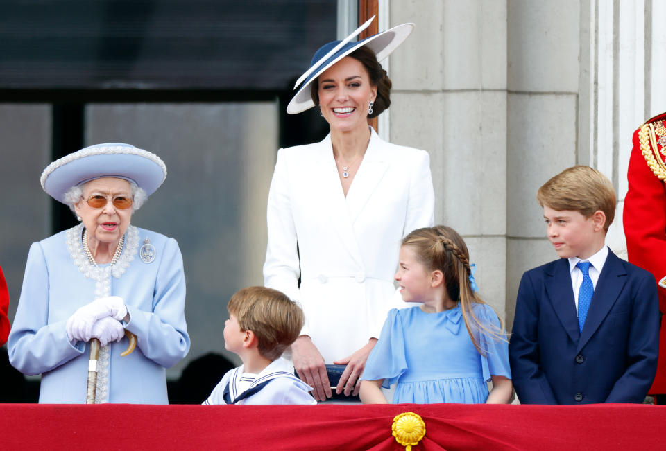 <p>The Queen watches a flypast from the balcony of Buckingham Palace during the Trooping the Colour with her great-grandchildren as part of her Platinum Jubilee celebrations. (Getty)</p> 