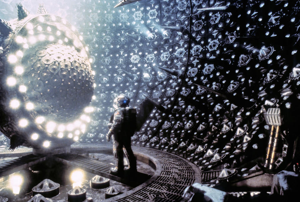 A member of the team studies the experimental engine of the Event Horizon. - Credit: Paramount/Everett Collection