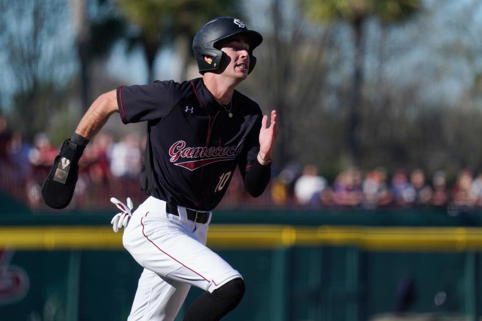 South Carolina outfielder Dylan Brewer runs to first during an NCAA baseball game against Clemson on Sunday, March 5, 2023, in Columbia, S.C. South Carolina won 7-1. (AP Photo/Sean Rayford)