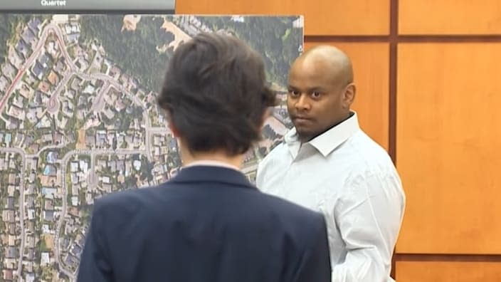 Newspaper carrier Sedrick Altheimer (right), testifying in court Tuesday, recalled delivering papers on his regular route in Tacoma, Washington, in January 2021 and being followed by Pierce County Sheriff Ed Troyer in his unmarked white SUV. (Photo: Screenshot/YouTube.com/KING 5)