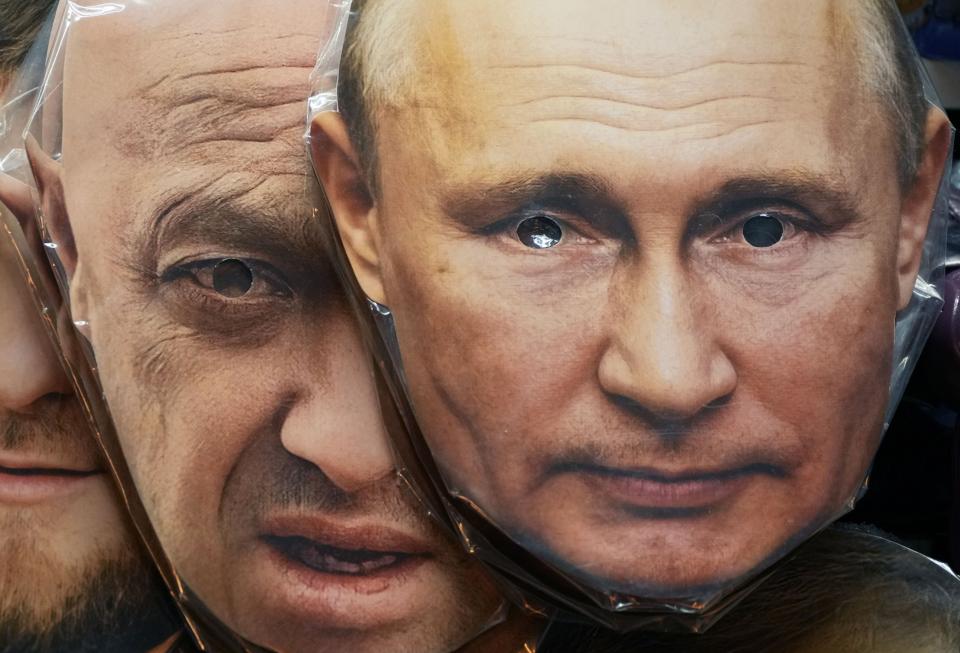 FILE - Face masks depicting Russian President Vladimir Putin, right, and owner of private military company Wagner Group Yevgeny Prigozhin are displayed among others for sale at a souvenir shop in St. Petersburg, Russia, Sunday, June 4, 2023. Russia's rebellious mercenary chief Yevgeny Prigozhin walked free from prosecution for his June 24, 2023 armed mutiny, and it's still unclear if anyone will face any charges in the aborted uprising against military leaders or for the deaths of the soldiers killed in it. (AP Photo, File)