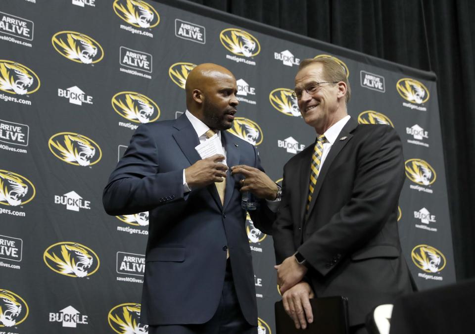 Missouri AD Jim Sterk, right, apologized on Thursday for his accusations against Dawn Staley. (AP)