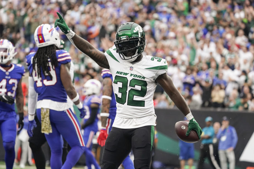 New York Jets running back Michael Carter celebrates after scoring a touchdown during the first half of an NFL football game against the Buffalo Bills, Sunday, Nov. 6, 2022, in East Rutherford, N.J. (AP Photo/John Minchillo)