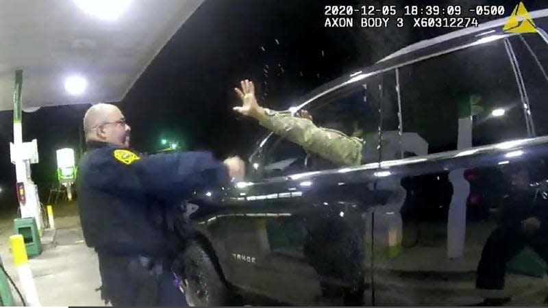 In this image from Windsor, Virginia Police body cameras, now-former Officer Joe Gutierrez is shown shooting pepper spray into the face of Petersburg, Virginia resident Caron Nazario during a traffic stop in Windsor Dec. 5, 2020. Nazario sued Gutierrez and fellow Officer Daniel Crocker for $1.5 million in damages, but on Tuesday, Jan. 17, 2023, a federal jury in Richmond awarded him less than $4,000. Nazario's lawyers say they will ask a federal judge to set aside the verdict and order a new trial.