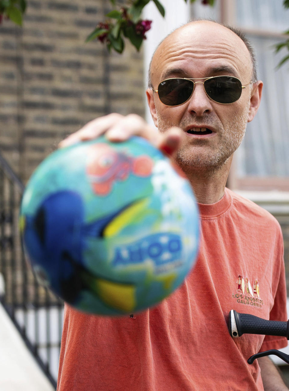 Britain's Prime Minister Boris Johnson's senior aid Dominic Cummings leaves his north London home, in London, Saturday May 23, 2020. The British government faced accusations of hypocrisy on Saturday after the revelation that Prime Minister Boris Johnson’s top adviser Cummings, traveled more than 250 miles (400 kms) to his parents’ house during a nationwide lockdown while he was showing coronavirus symptoms. (Aaron Chown/PA via AP)