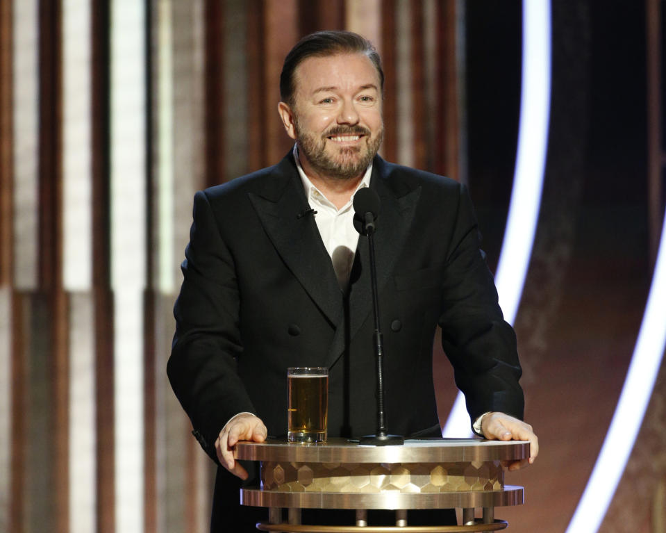 This image released by NBC shows host Ricky Gervais speaking at the 77th Annual Golden Globe Awards at the Beverly Hilton Hotel in Beverly Hills, Calif., on Sunday, Jan. 5, 2020. (Paul Drinkwater/NBC via AP)