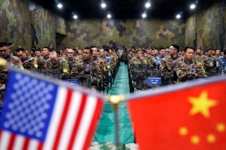 U.S. Army and China's People's Liberation Army (PLA) military personnel attend a closing ceremony of an exercise of