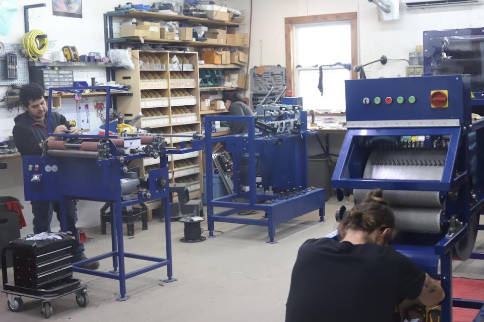 In the workshop, employees assemble the machines, before shipping them to customers, some who have waited up to two years for a mini mill because of high demand.