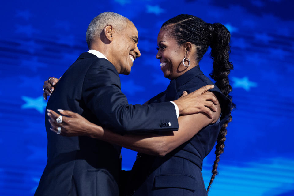 Former President Barack Obama and former first lady Michelle Obama appear on stage at the Democratic National Convention in Chicago on Aug. 20. (Tom Williams/CQ-Roll Call via Getty Images)