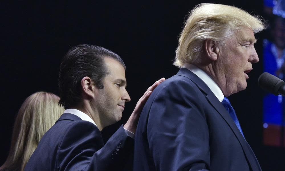 Donald Trump Jr with his father during an election rally.