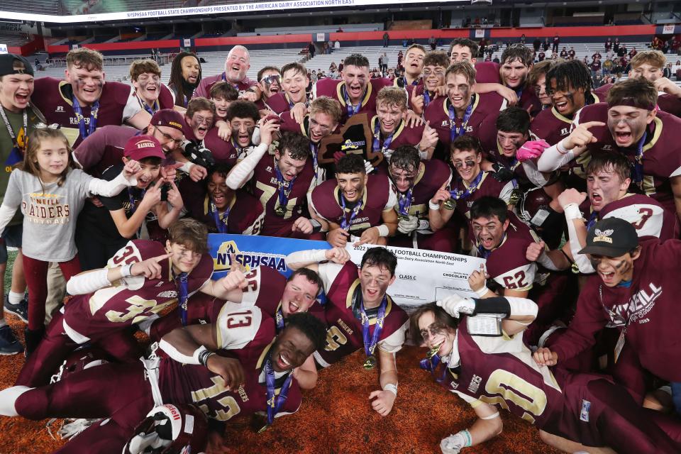 O'Neill players celebrate after defeating General Brown to win the state Class C football championships at JMA Wireless Dome in Syracuse Dec. 3, 2022. 