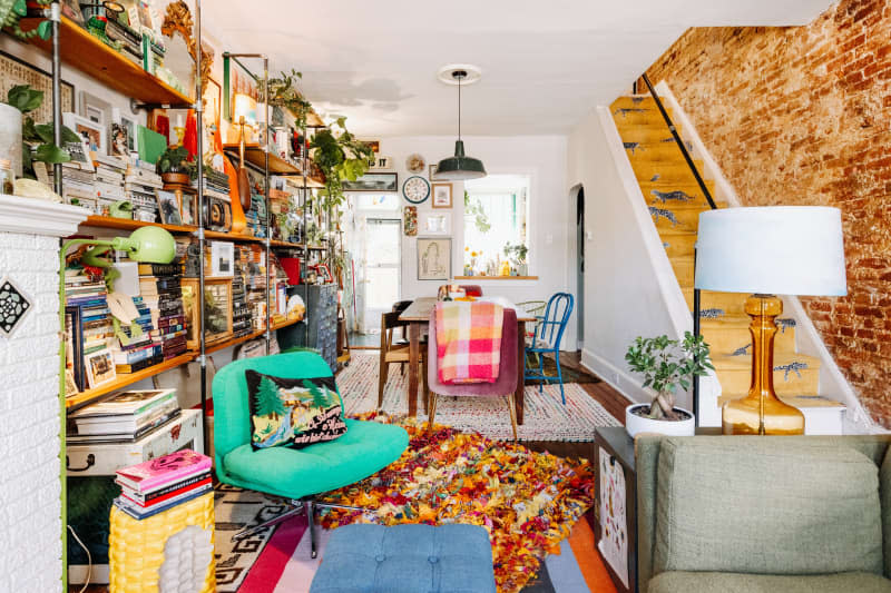 Living room with wall-mounted shelving.