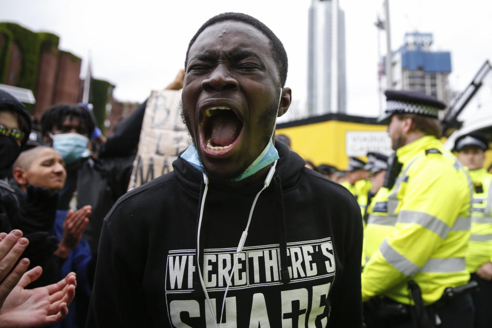 LONDON, UNITED KINGDOM - JUNE 06: Protesters demonstrate near the the US Embassy in Nine Elms on June 6, 2020 in London, United Kingdom. The death of an African-American man, George Floyd, while in the custody of Minneapolis police has sparked protests across the United States, as well as demonstrations of solidarity in many countries around the world. (Photo by Hollie Adams/Getty Images)