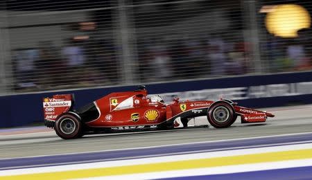 Ferrari Formula One driver Sebastian Vettel of Germany drives during the Singapore F1 Grand Prix at the Marina Bay street circuit September 20, 2015. REUTERS/Tim Chong