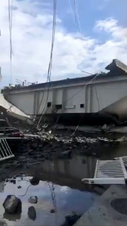 Debris from the collapsed Nanfang'ao Bridge are seen after a typhoon hit Su'ao in Yilan county, Taiwan