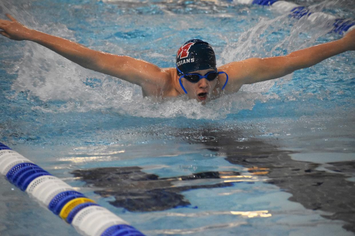 Martinsville swimmer Jack Bruce competes in the 100-yard butterfly during sectional preliminaries at Franklin Community High School on Feb. 17, 2022.