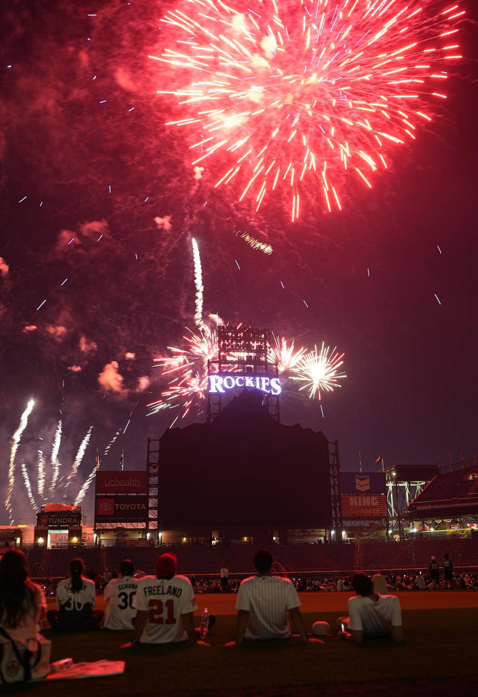 Fireworks light up the sky over Coors Field to mark the Independence Day holiday after the Colorado Rockies defeated the Milwaukee Brewers in a baseball game Thursday, July 4, 2024, in Denver. (AP Photo/David Zalubowski)