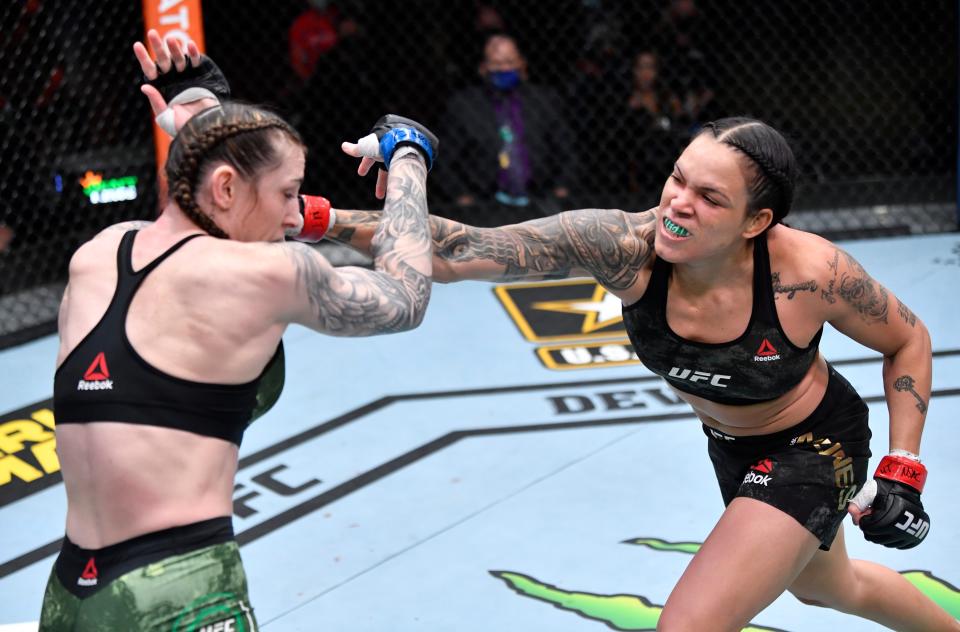 Amanda Nunes (right) retained her women’s featherweight title in dominant fashionZuffa LLC via Getty Images