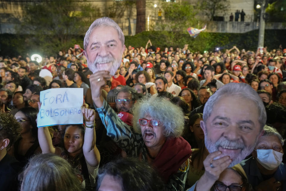 Supporters of Brazil's former President Luiz Inacio Lula da Silva, who is running for reelection, cheer during a campaign rally "in defense of democracy" at the Pontiff Catholic University in Sao Paulo, Brazil, Monday, Oct. 24, 2022. Da Silva will face Brazilian President Jair Bolsonaro in a presidential runoff on Oct. 30. (AP Photo/Andre Penner)