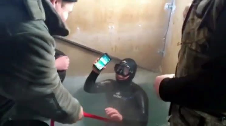 A diver retrieves an iPhone (CEN)